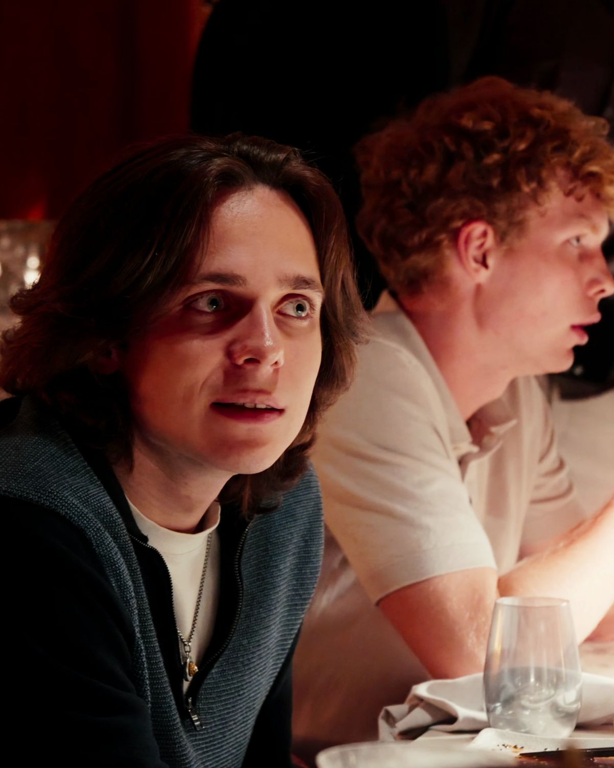 Two guests deep in conversation across the table
